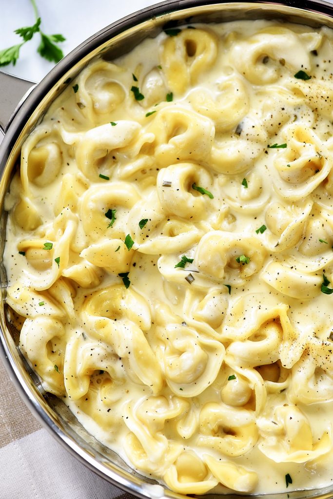 Tortellini Alfredo has a rich and creamy homemade Alfredo sauce poured over cheese-filled tortellini. Life-in-the-Lofthouse.com