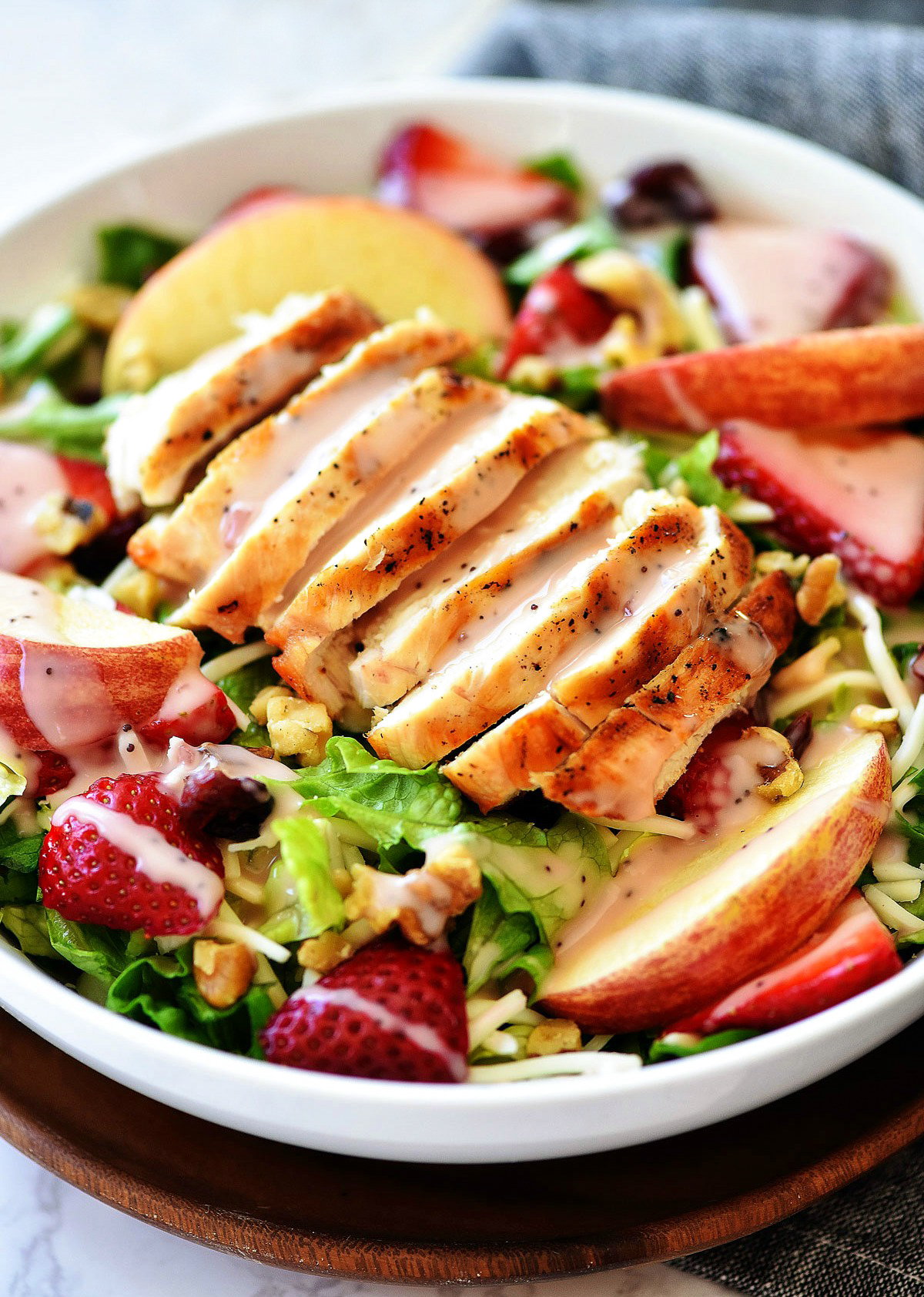The Best Strawberry Chicken Salad is a refreshing salad full of grilled chicken, strawberries, sliced apples, mozzarella cheese and more. Life-in-the-Lofthouse.com