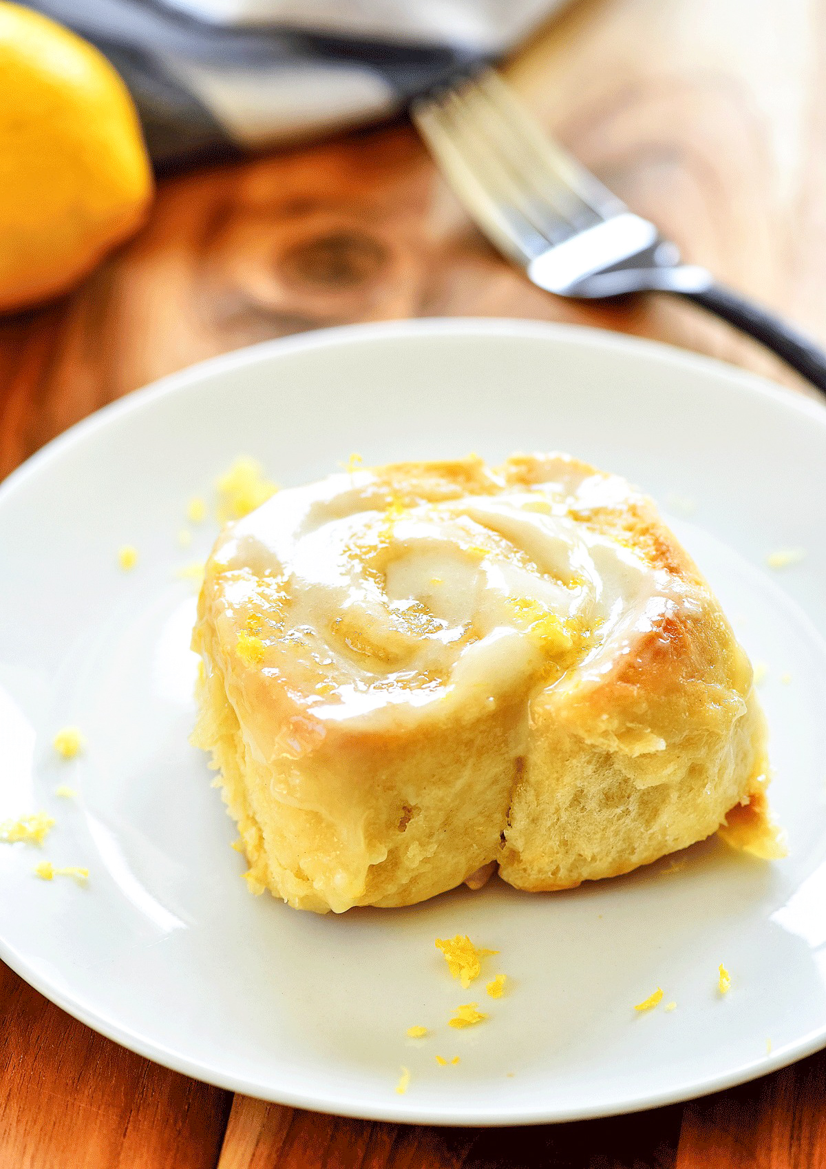 Sticky Lemon Rolls with Lemon Cream Cheese Glaze are gooey, soft and delicious rolls full of lemon flavor topped with a lemon cream cheese glaze. Life-in-the-Lofthouse.com
