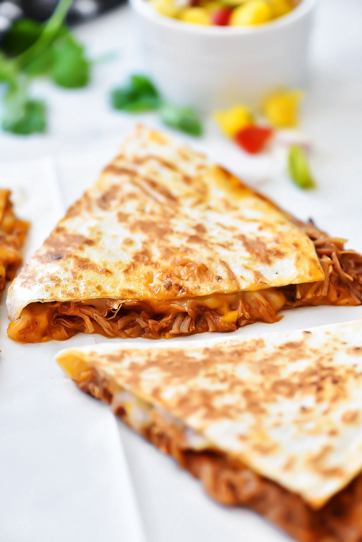Sweet Pork Quesadillas start with savory, sweet shredded pork and loads of cheddar and Monterey jack cheese between two crispy flour tortillas. Life-in-the-Lofthouse.com