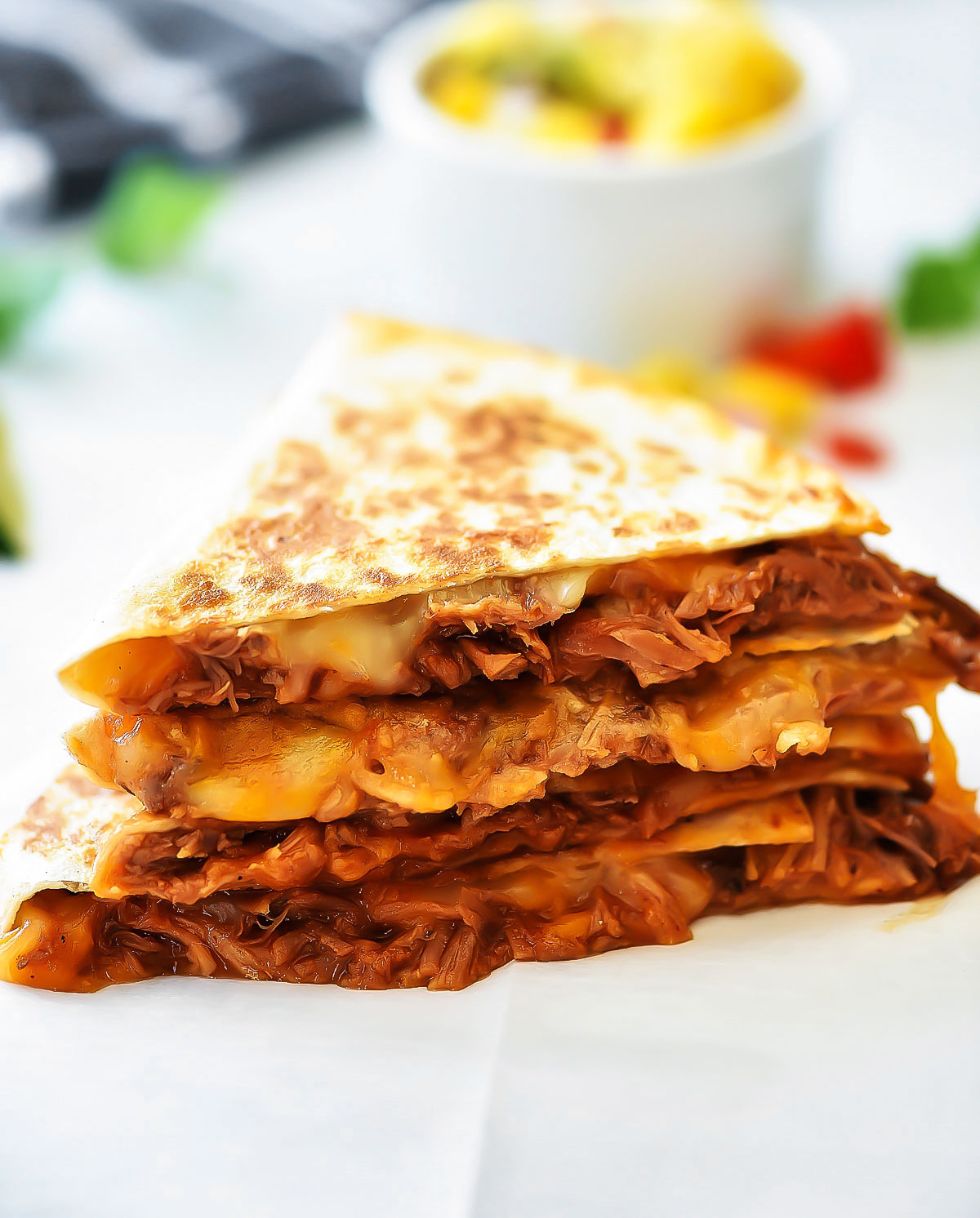 Sweet Pork Quesadillas start with savory, sweet shredded pork and loads of cheddar and Monterey jack cheese between two crispy flour tortillas. Life-in-the-Lofthouse.com