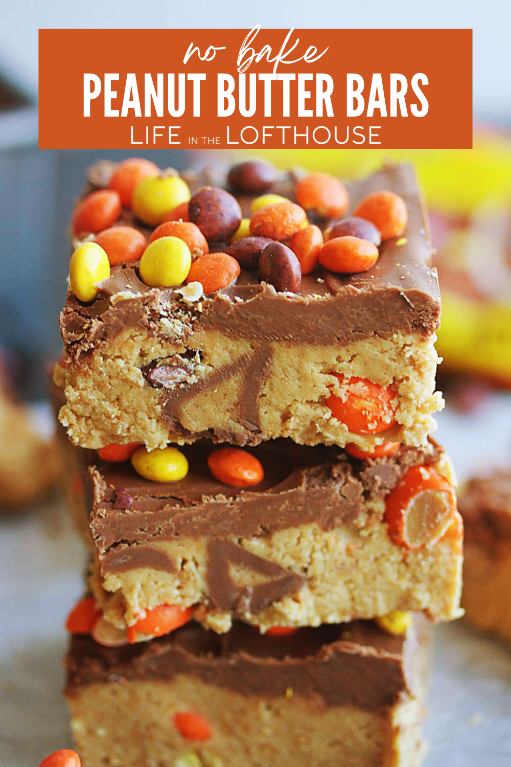 No Bake Peanut Butter Bars with mini peanut butter cups, Reese's Pieces, and chocolate chips