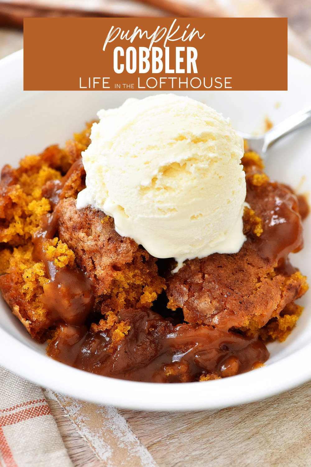 Indulge in a fluffy pumpkin cobbler with a gooey caramel sauce&mdash;perfect for fall gatherings! Easy to make, warm, and holiday-ready.