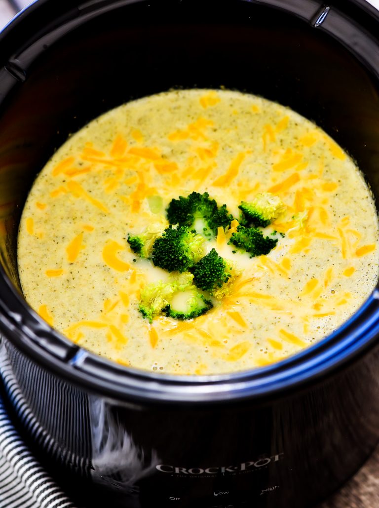 Slow Cooker Broccoli Cheese Soup is a creamy soup made with fresh broccoli, carrots and freshly grated sharp cheddar cheese. Life-in-the-Lofthouse.com
