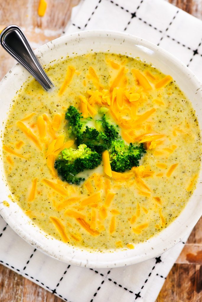 Slow Cooker Broccoli Cheese Soup is a creamy soup made with fresh broccoli, carrots and freshly grated sharp cheddar cheese. Life-in-the-Lofthouse.com
