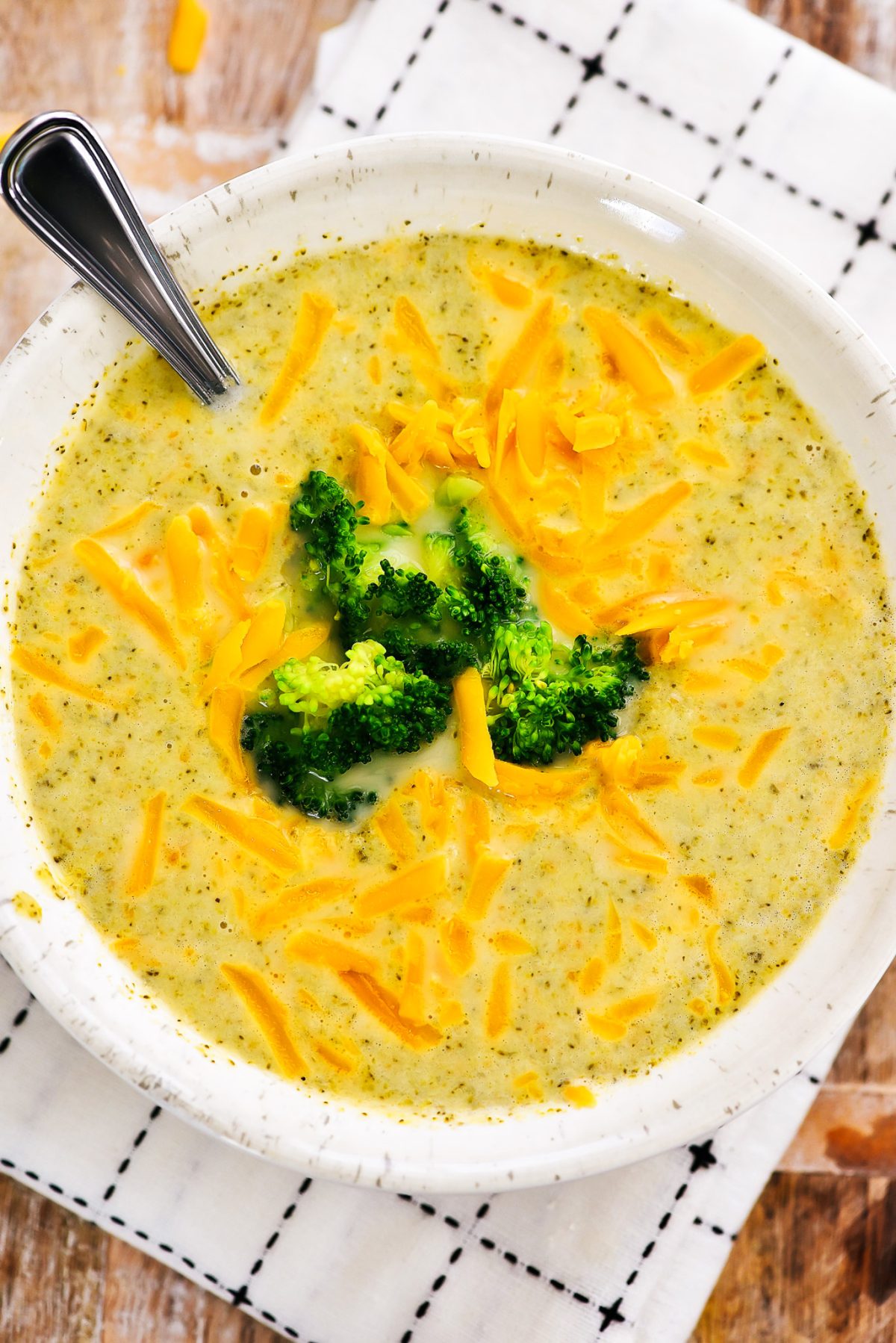 Slow Cooker Broccoli Cheese Soup is a creamy soup made with fresh broccoli, carrots and freshly grated sharp cheddar cheese. Life-in-the-Lofthouse.com