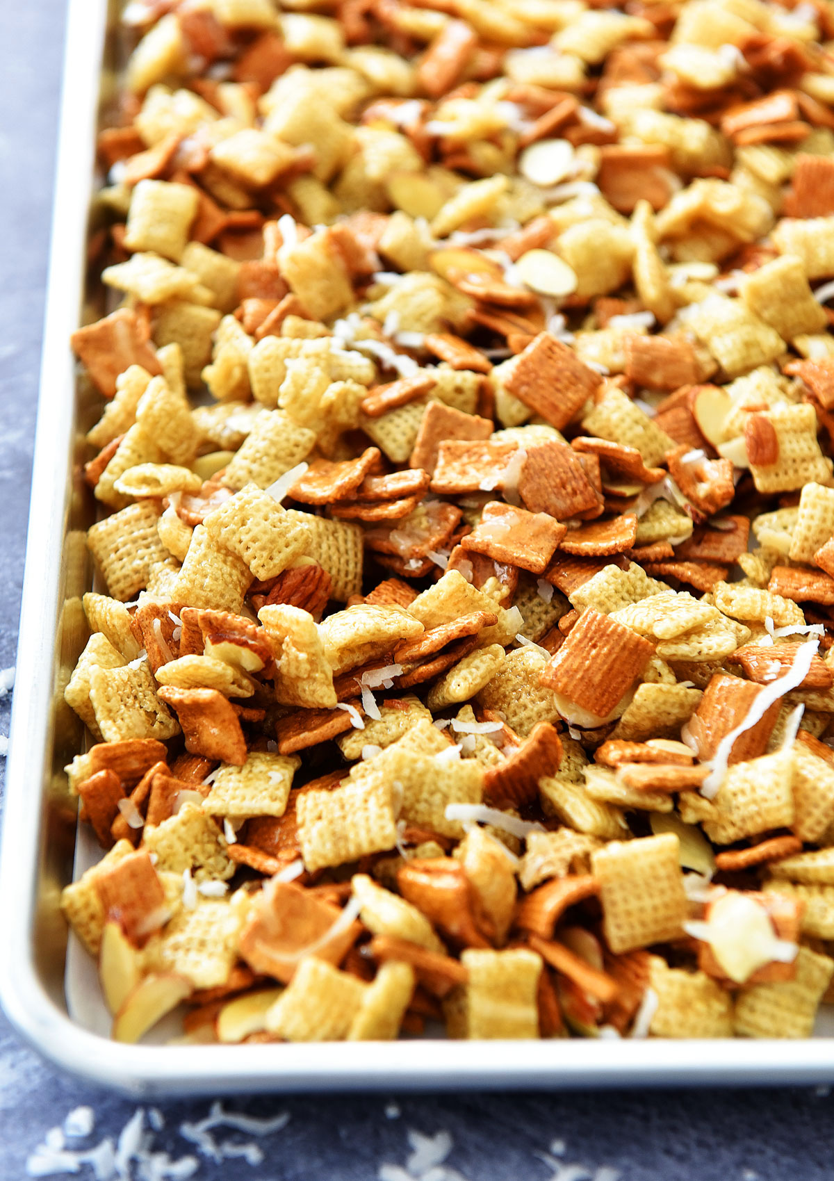 Gooey Chex Mix is a sweet and salty snack with coconut and almonds. Life-in-the-Lofthouse.com