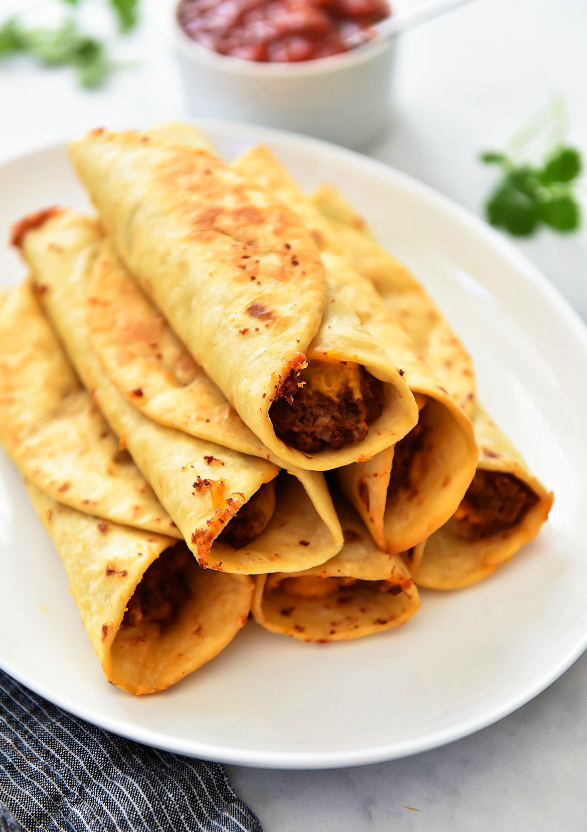 Crisp Bean Burritos are filled with cheesy refried beans all wrapped inside a flour tortilla then deep-fried. Life-in-the-Lofthouse.com