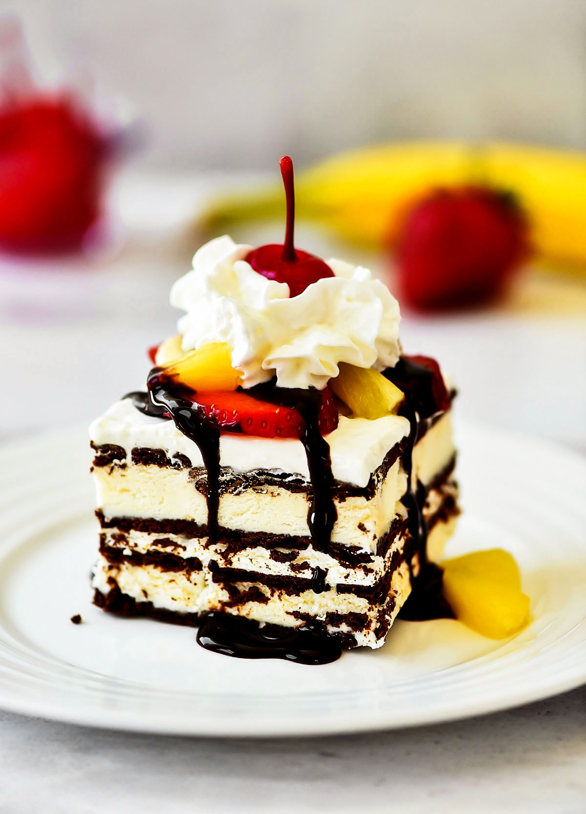 Banana Split Ice Cream Sandwich Cake has layers of ice cream sandwiches, Cool Whip and fresh fruit. Life-in-the-Lofthouse.com