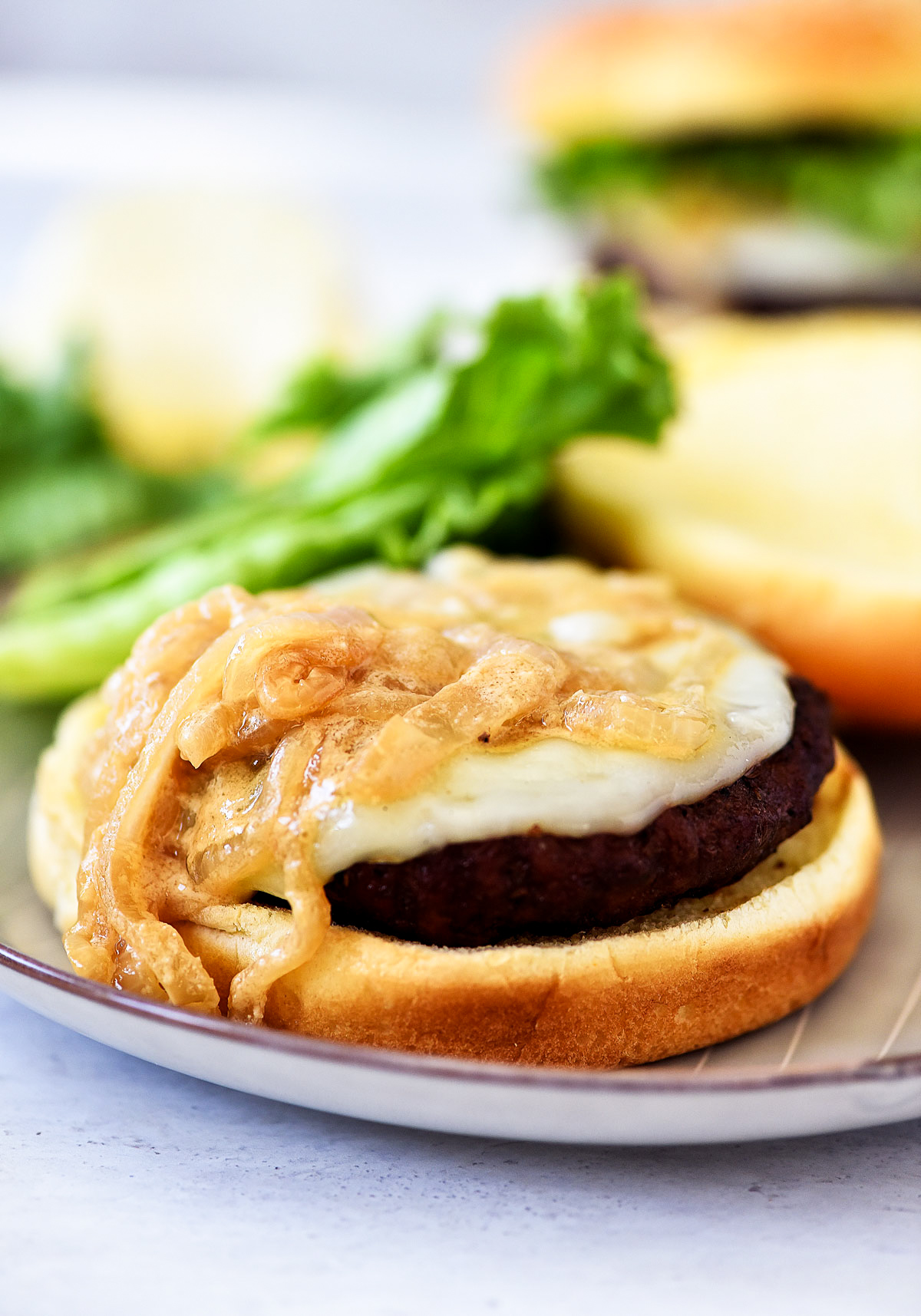 French Onion Burgers are loaded with provolone cheese and caramelized onions. Life-in-the-Lofthouse.com