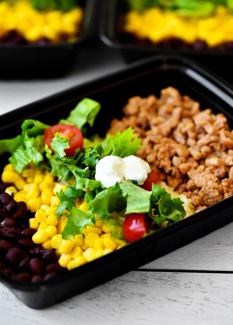 Taco Salad Meal Prep Bowls are filled with seasoned ground turkey, rice, beans, corn and lettuce. Life-in-the-Lofthouse.com