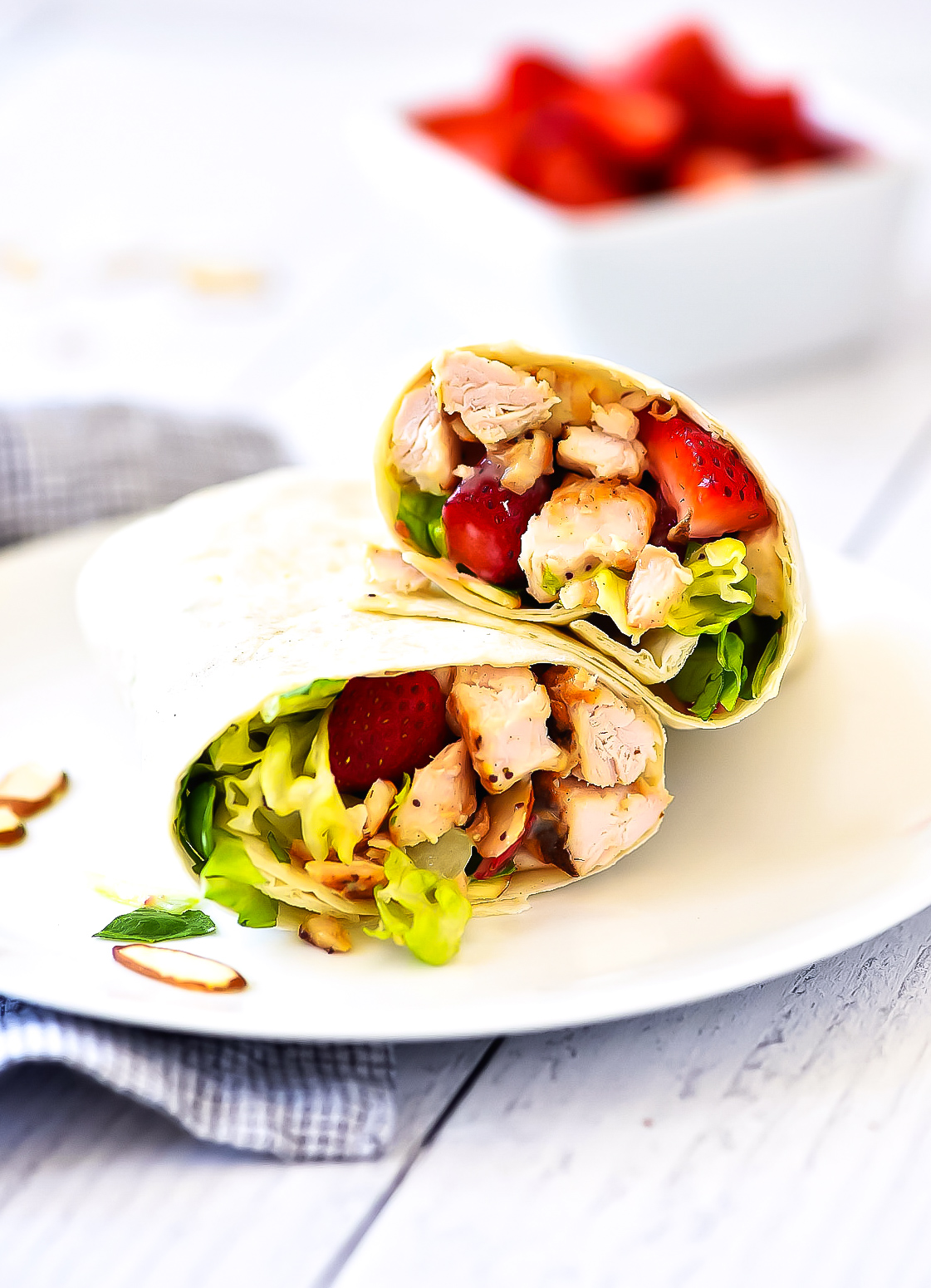 Strawberry Chicken Wraps are filled with grilled chicken, romaine lettuce, creamy poppy seed dressing and strawberries. Life-in-the-Lofthouse.com