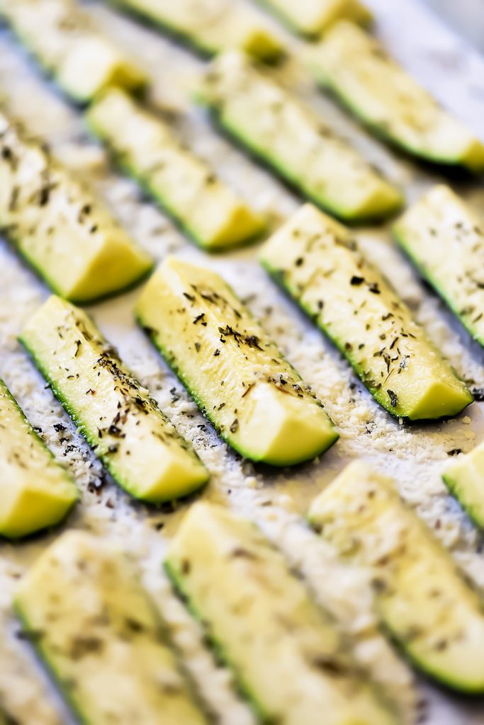 Baked zucchini covered in Parmesan cheese and full of Italian flavor. Life-in-the-Lofthouse.com