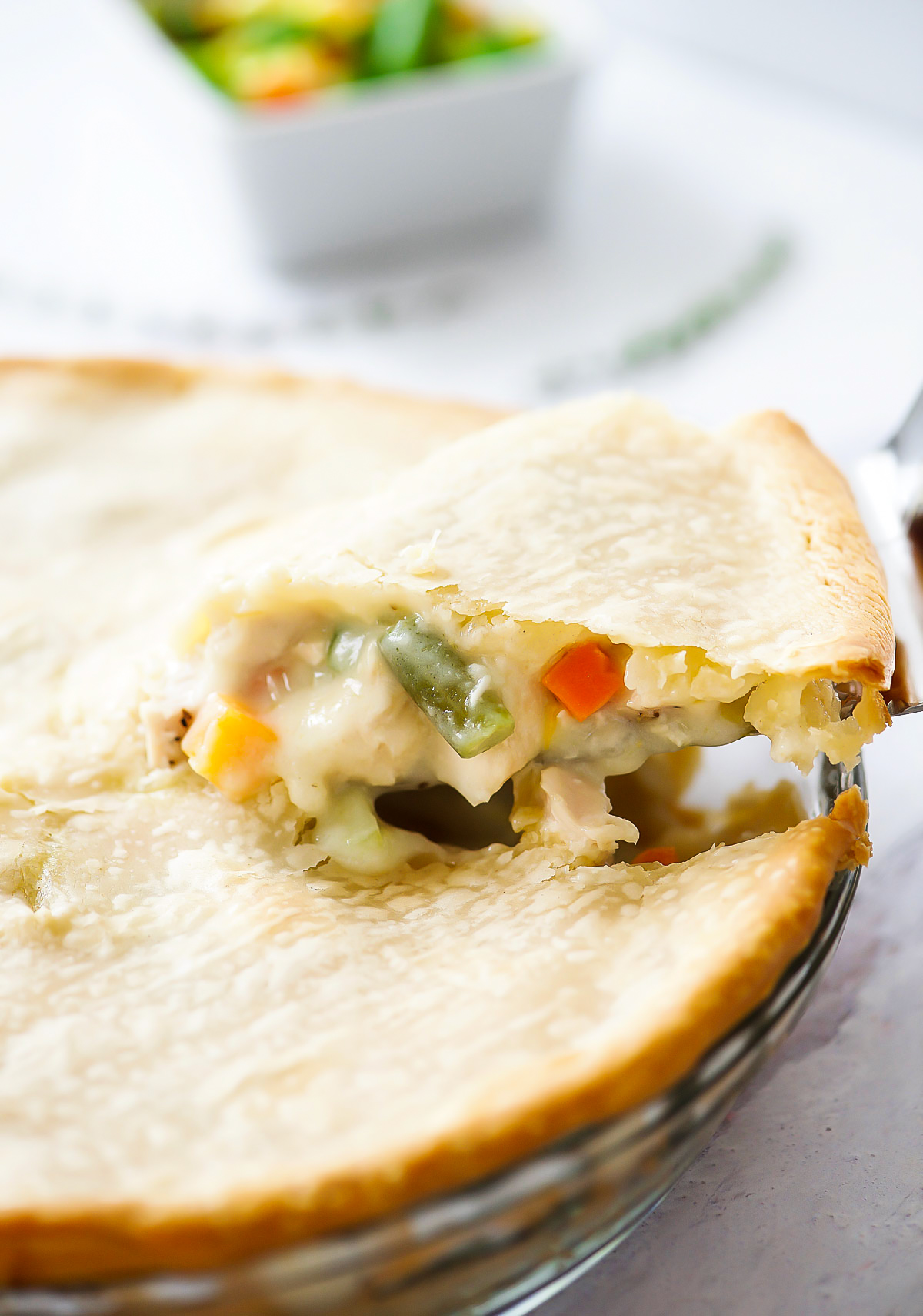 Chicken Pot Pie is a delicious savory pie filled with a chicken and vegetable filling inside a flaky pie crust. Life-in-the-Lofthouse.com