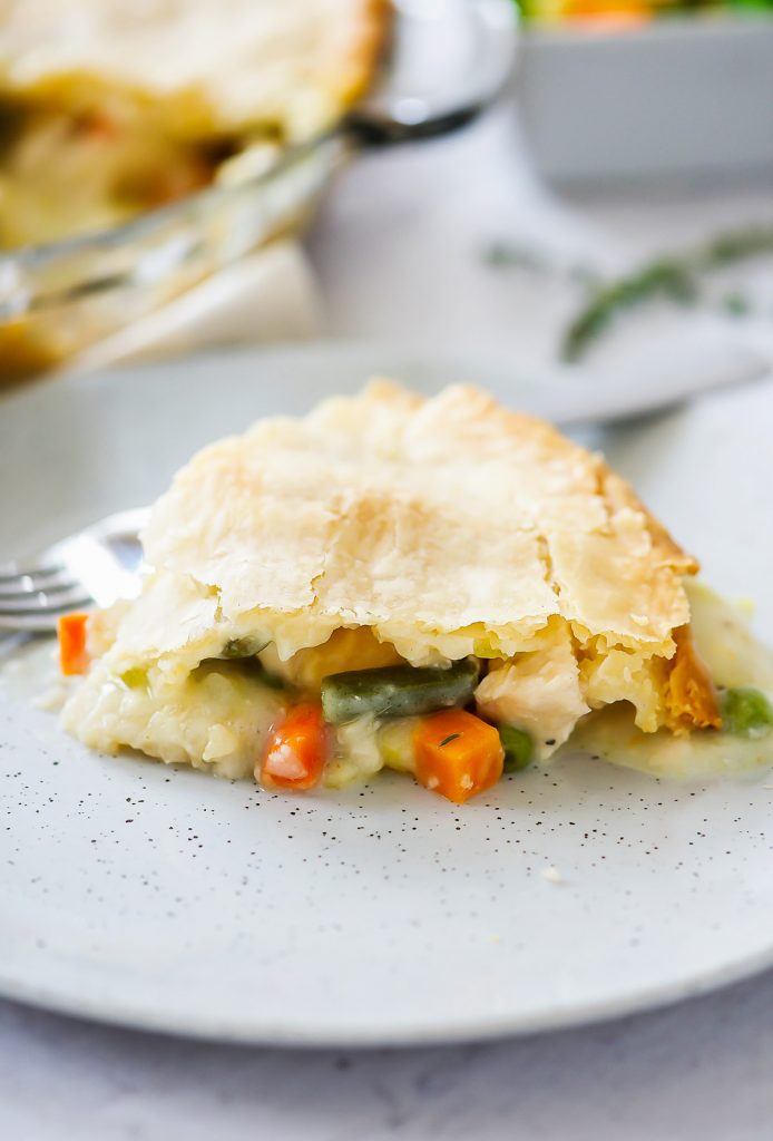 Chicken Pot Pie is a delicious savory pie filled with a chicken and vegetable filling inside a flaky pie crust. Life-in-the-Lofthouse.com