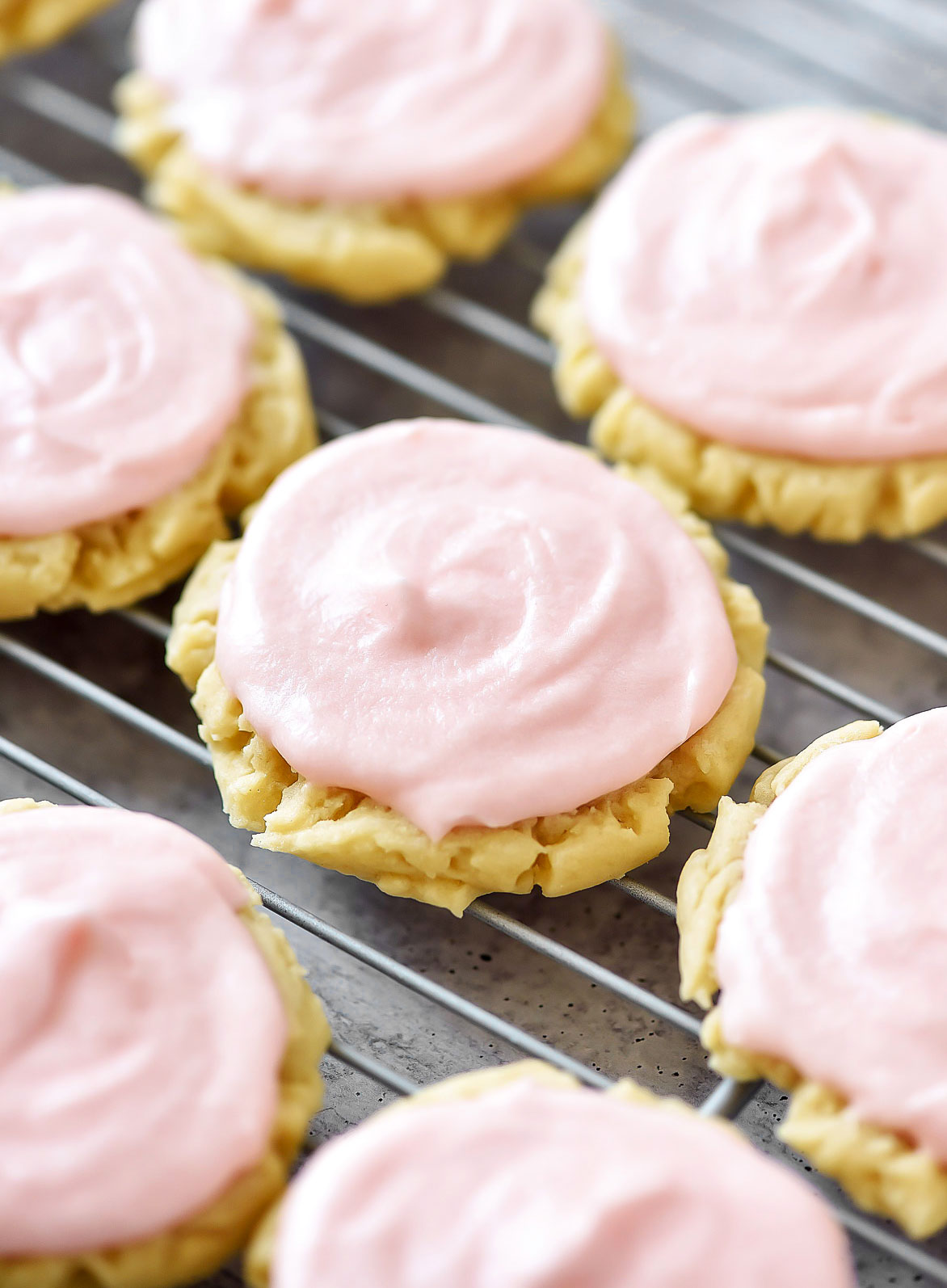Soft and delicious sugar cookies with a creamy pink frosting. Life-in-the-Lofthouse.com