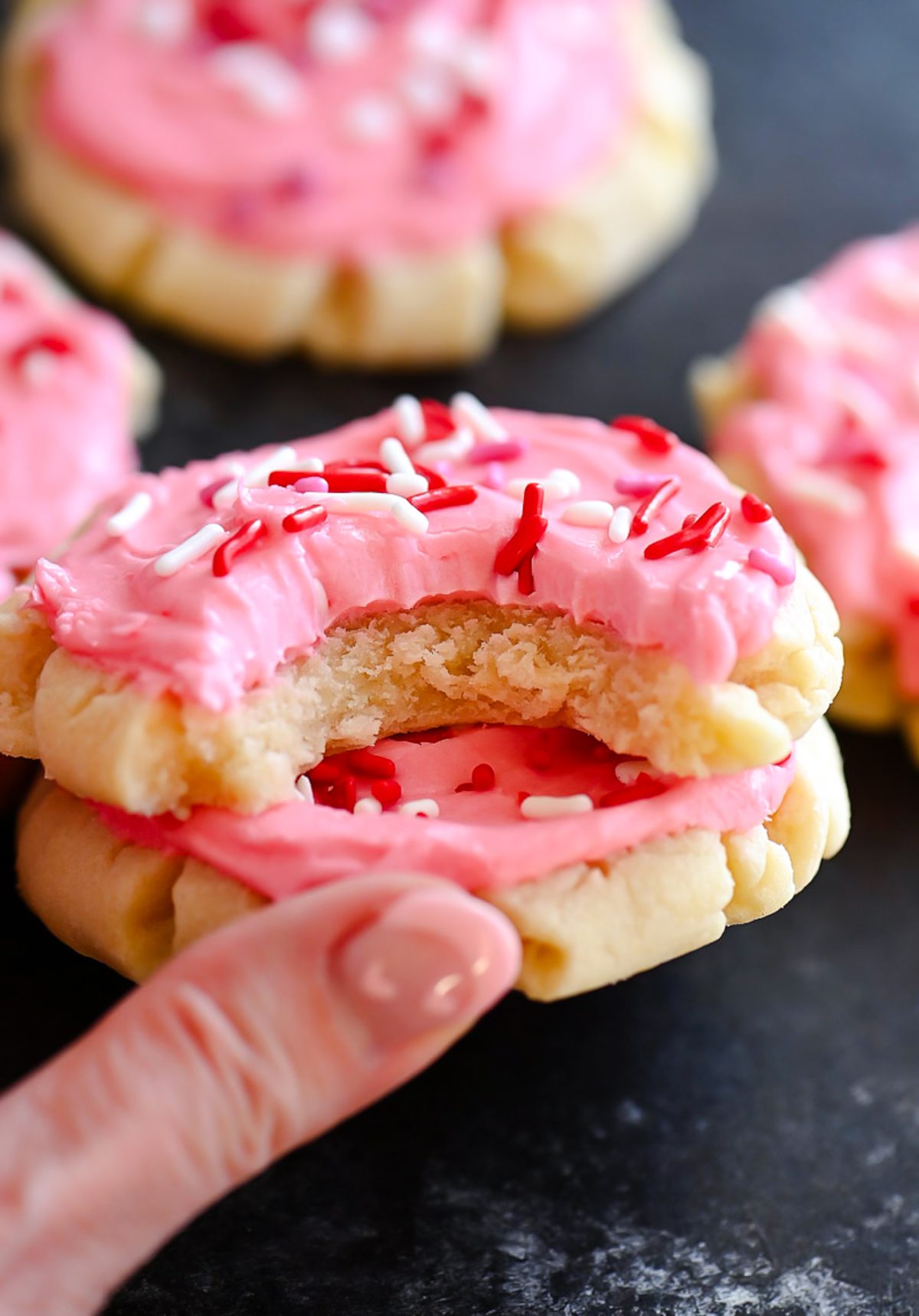 Soft and delicious sugar cookies with a creamy pink frosting. Life-in-the-Lofthouse.com