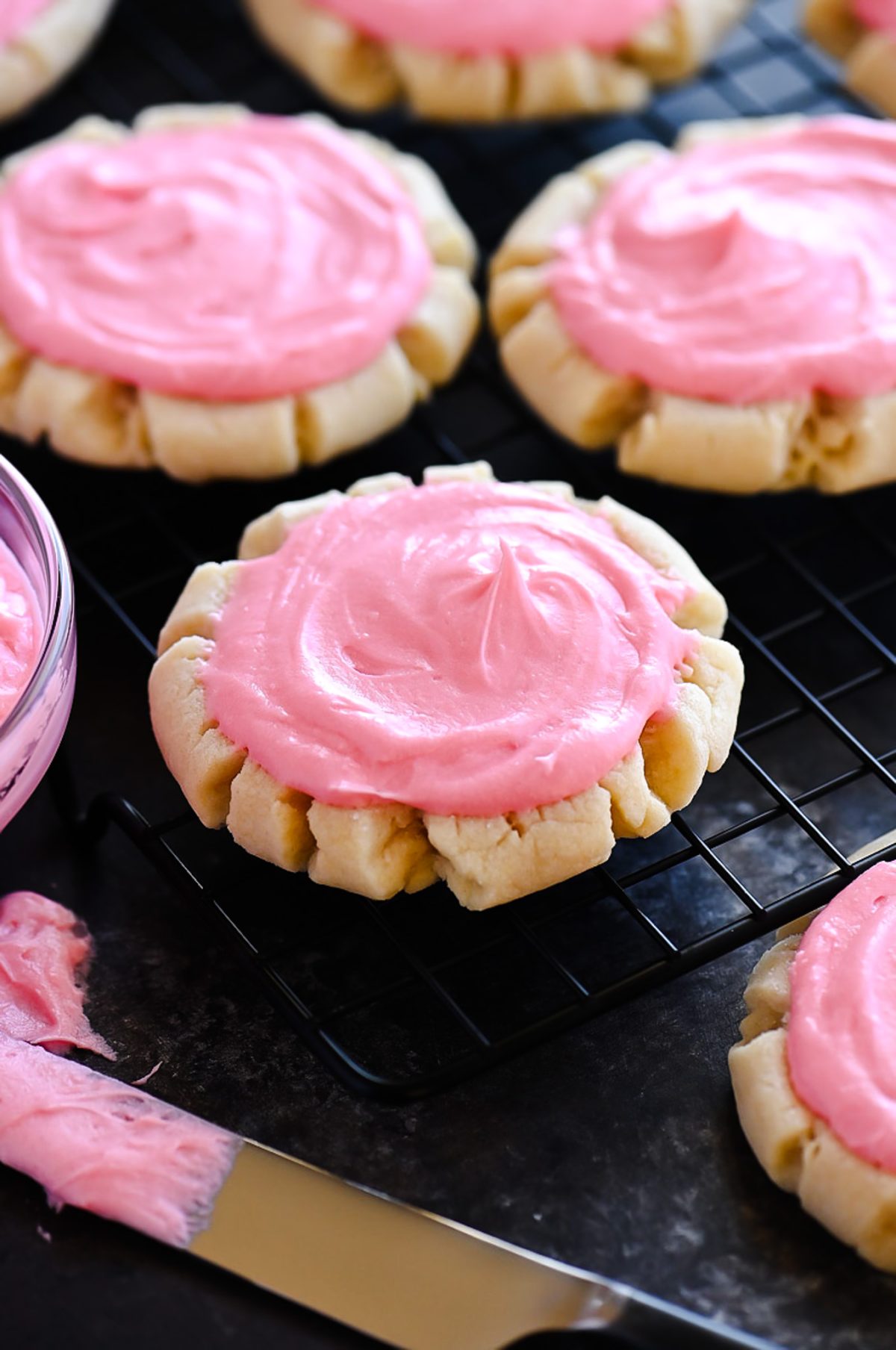 Soft and delicious sugar cookies with a creamy pink frosting. Life-in-the-Lofthouse.com