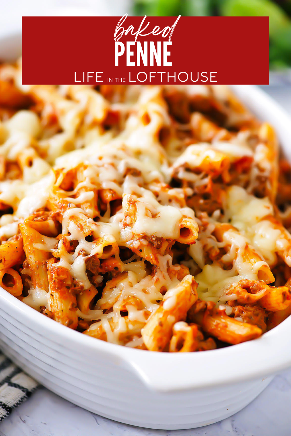 Baked Penne is a classic and hearty pasta dish that is made by layering penne pasta, spaghetti sauce and a cream cheese mixture then baked to perfection! It&rsquo;s absolute comfort in a pan!