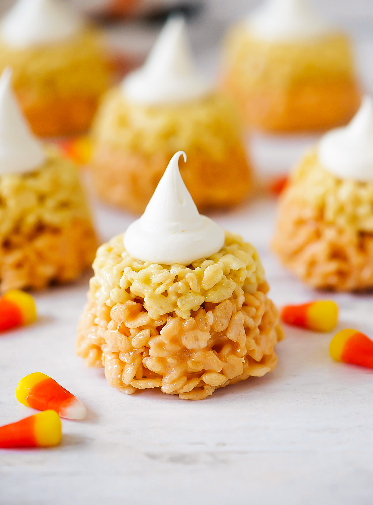 Candy Corn Rice Krispie Cupcakes are rice krispie treats colored and shaped just like a candy corn. Life-in-the-Lofthouse.com