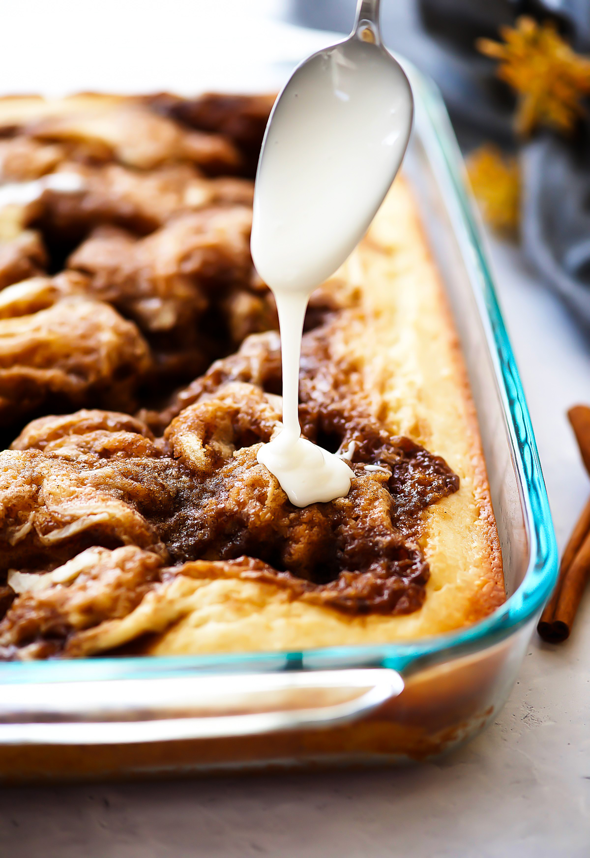 Cinnamon Roll Cake is a moist and buttery cinnamon cake with a creamy vanilla glaze drizzled over the top. Life-in-the-Lofthouse.com