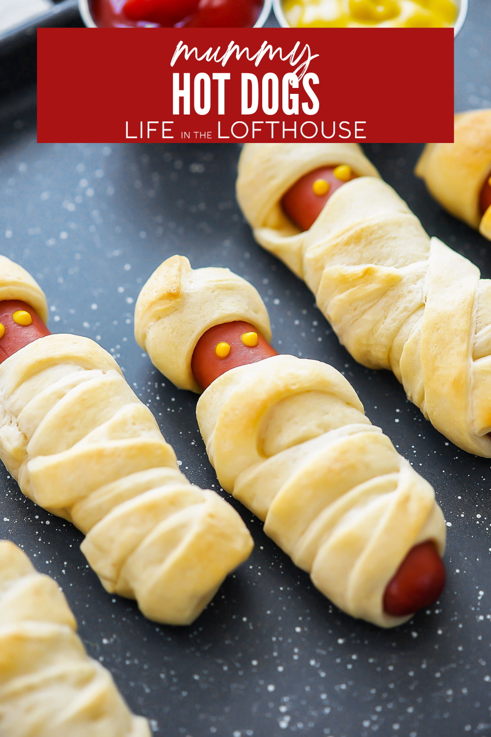 Make spooky Mummy Hot Dogs with crescent roll dough, hot dogs, and mustard eyes. A quick, kid-friendly Halloween recipe everyone will love!