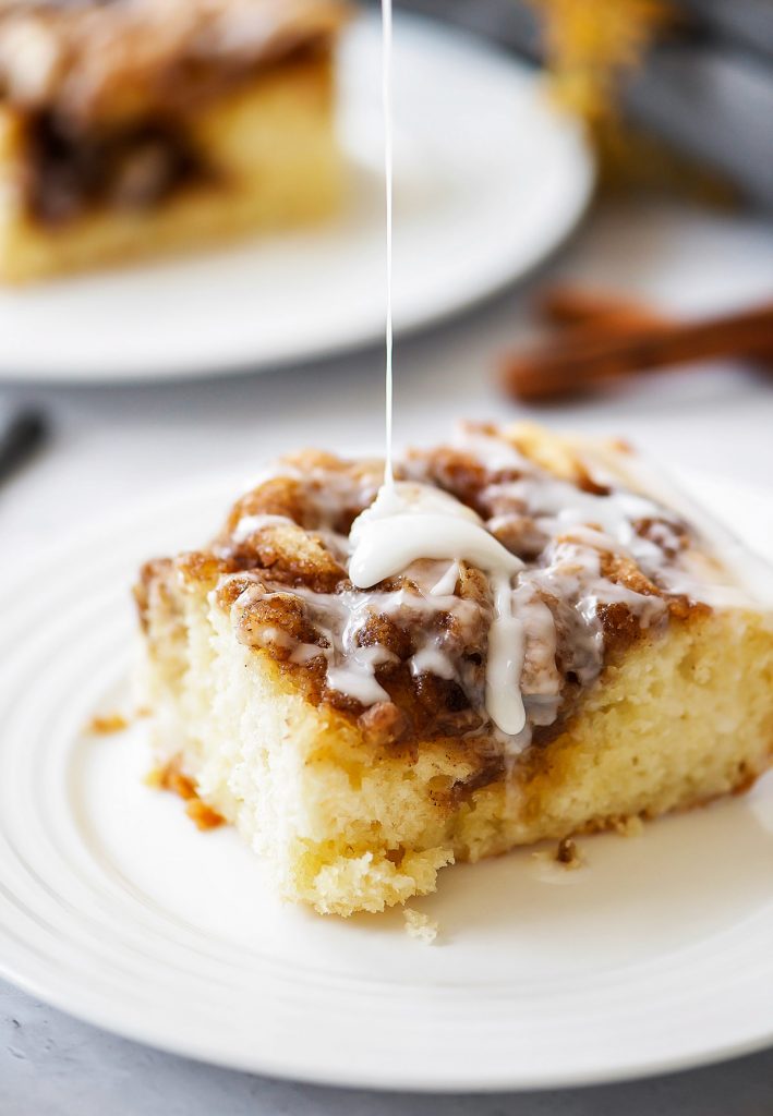 Cinnamon Roll Cake is a moist and buttery cinnamon cake with a creamy vanilla glaze drizzled over the top. Life-in-the-Lofthouse.com