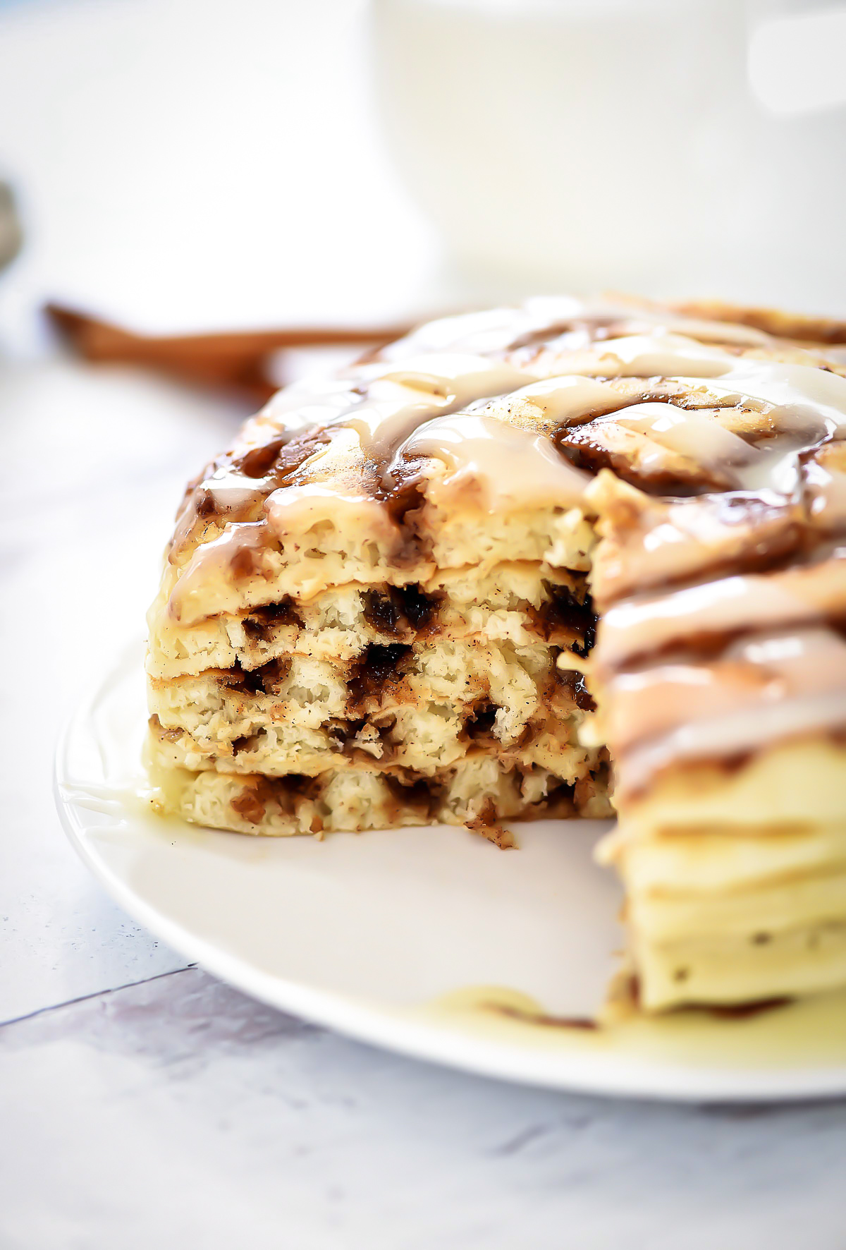 Cinnamon Roll Pancakes have swirls of cinnamon through out and are topped with a delicious cream cheese glaze. Life-in-the-Lofthouse.com