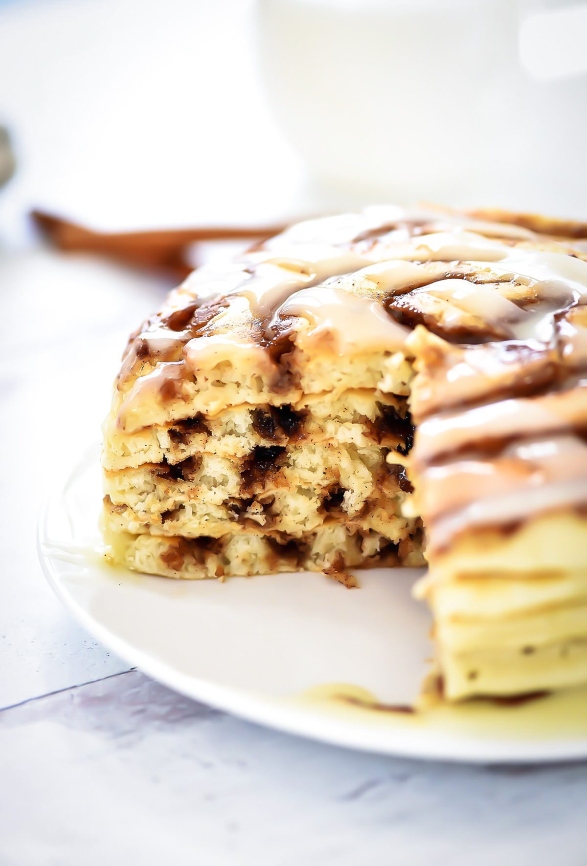 Cinnamon Roll Pancakes have swirls of cinnamon through out and are topped with a delicious cream cheese glaze. Life-in-the-Lofthouse.com