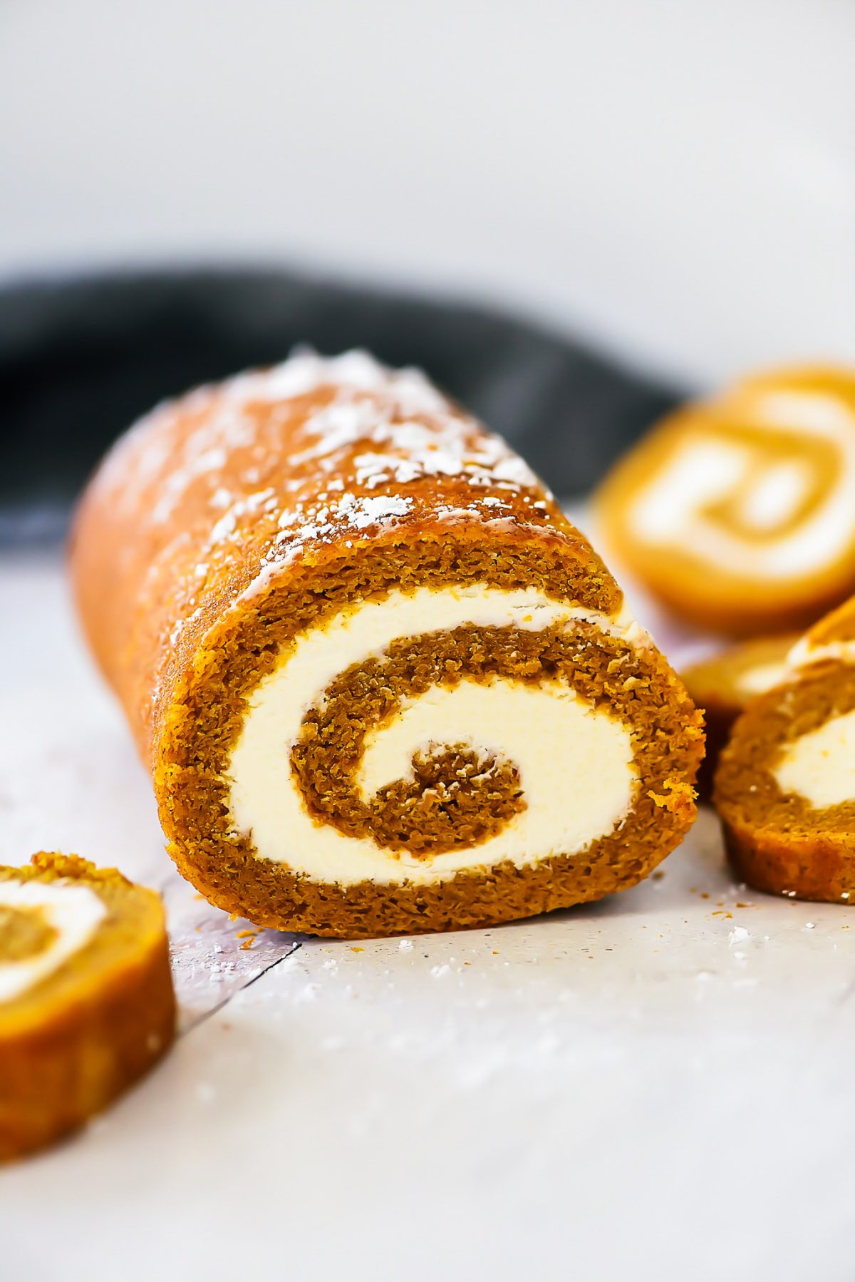 Soft pumpkin cake rolled up and filled with a creamy cream cheese filling. Life-in-the-Lofthouse.com