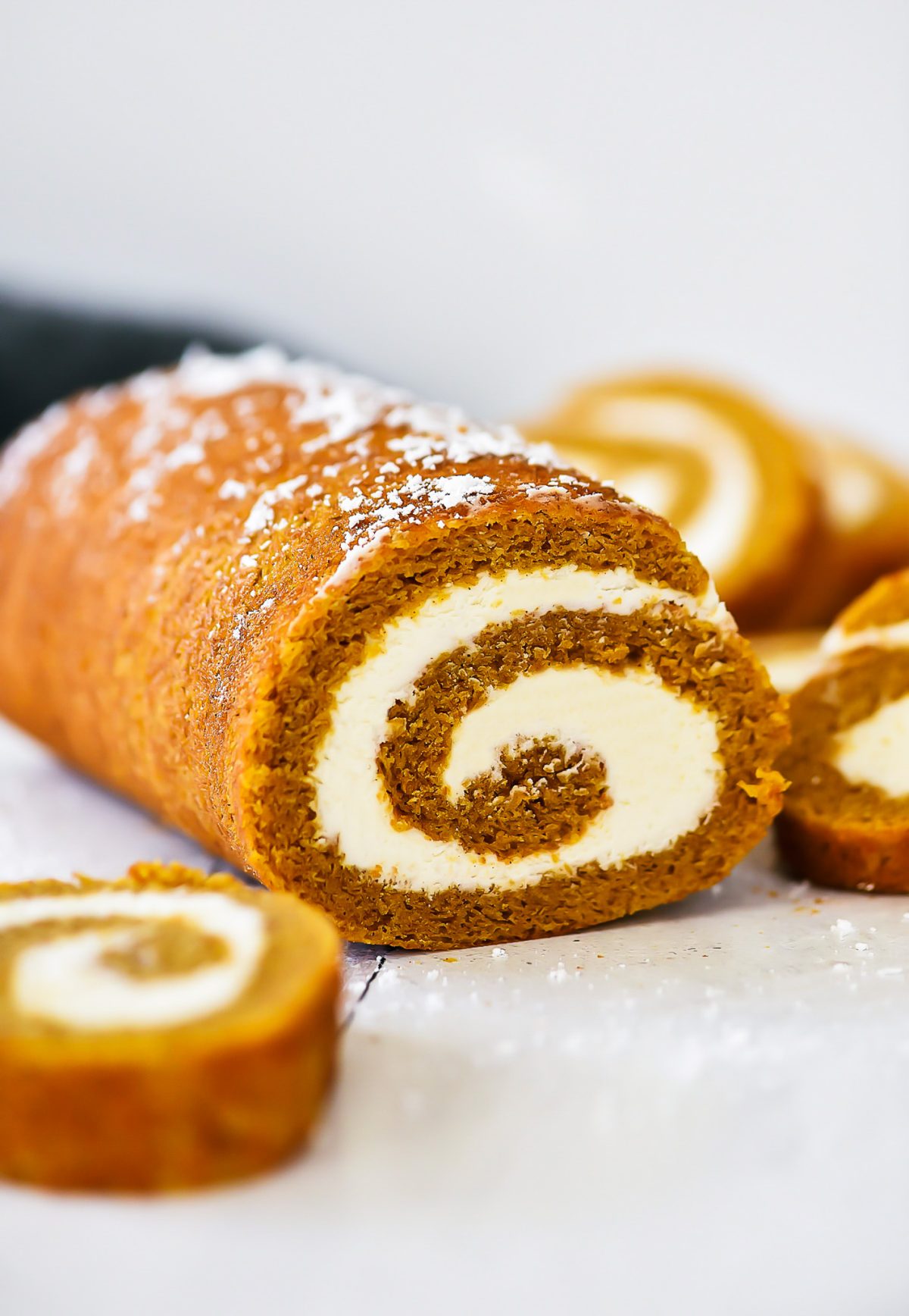 Soft pumpkin cake rolled up and filled with a creamy cream cheese filling. Life-in-the-Lofthouse.com