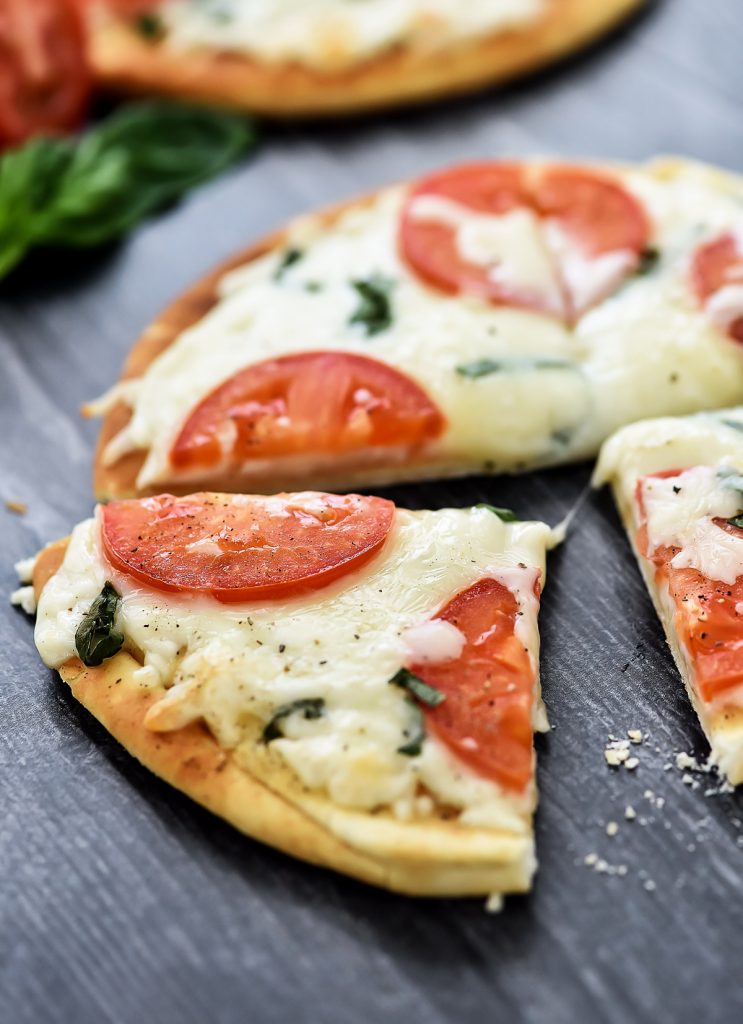 Margherita Flatbread Pizza is topped with Mozzarella and Parmesan cheese, sliced tomatoes and fresh basil over a flatbread crust. Life-in-the-Lofthouse.com