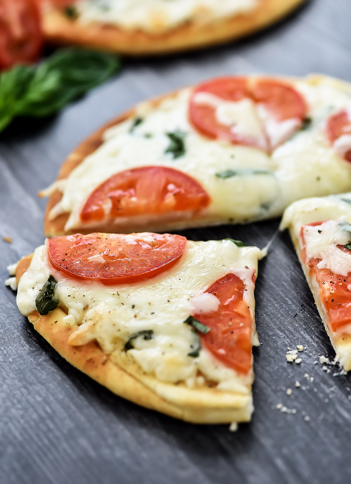 Margherita Flatbread Pizza is topped with Mozzarella and Parmesan cheese, sliced tomatoes and fresh basil over a flatbread crust. Life-in-the-Lofthouse.com