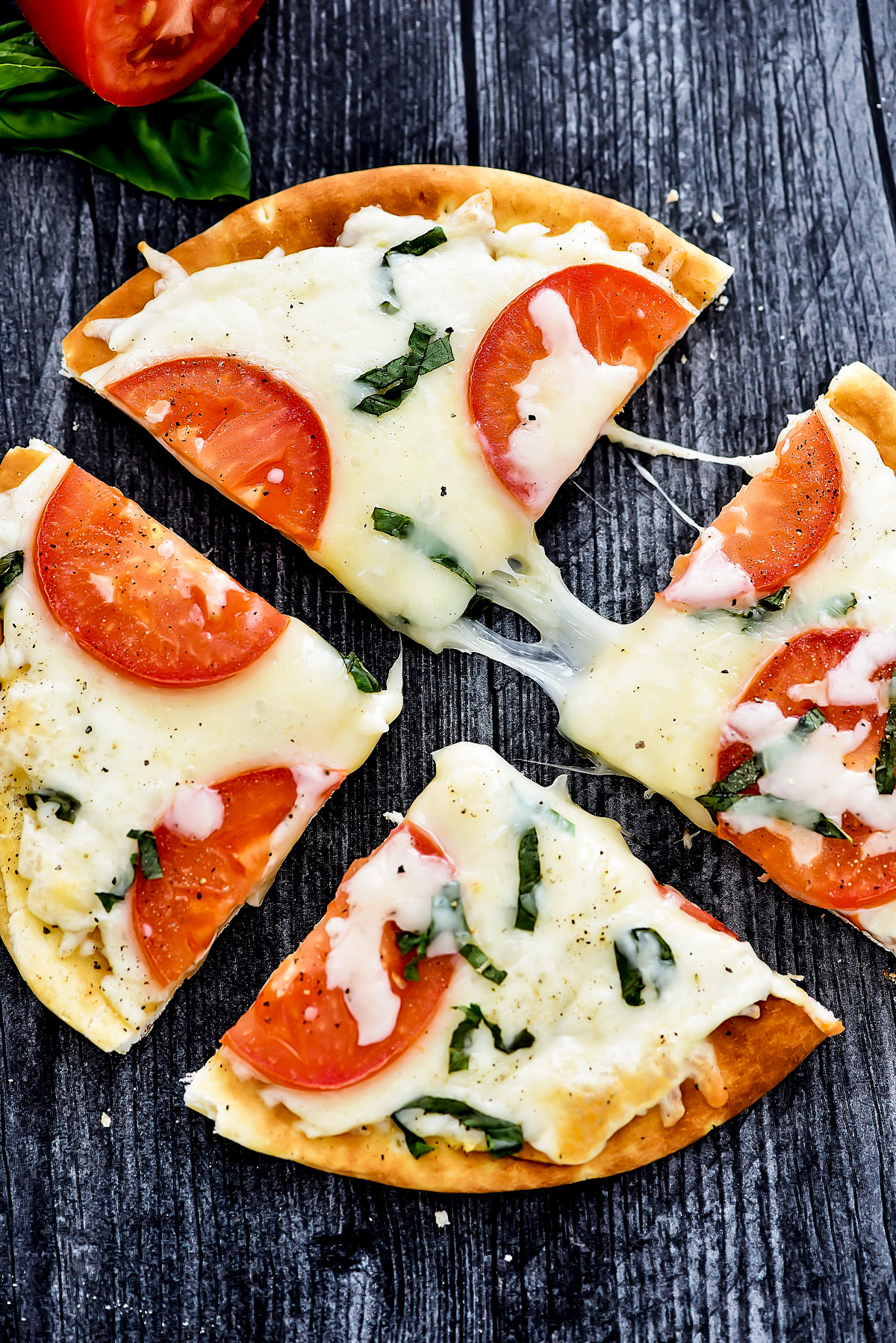 Margherita Flatbread Pizza is topped with Mozzarella and Parmesan cheese, sliced tomatoes and fresh basil over a flatbread crust. Life-in-the-Lofthouse.com