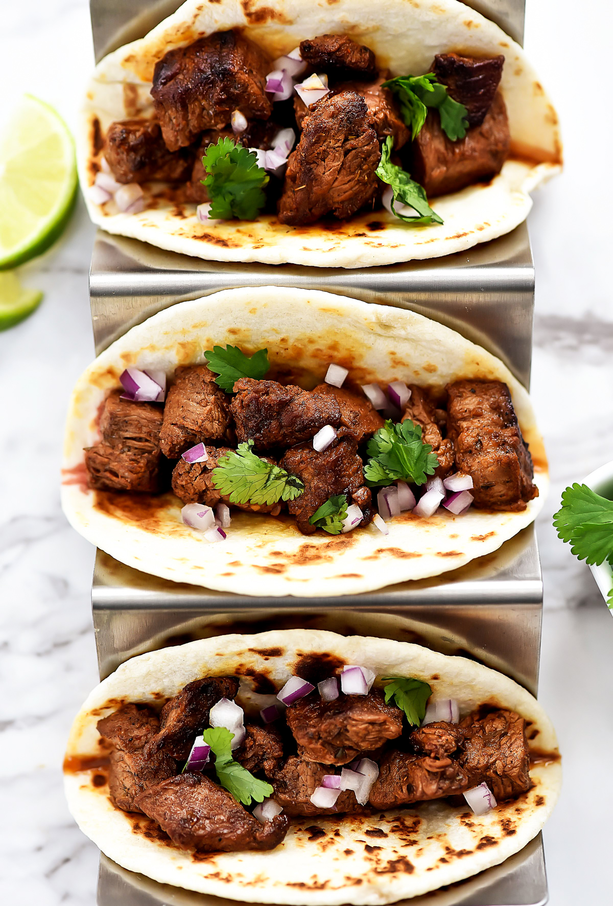 Mexican Street Tacos are filled with carne asada, cilantro and red onion served in corn or flour tortillas. Life-in-the-Lofthouse.com