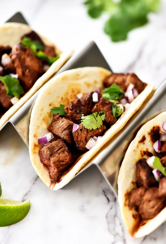 Mexican Street Tacos are filled with carne asada, cilantro and red onion served in corn or flour tortillas. Life-in-the-Lofthouse.com