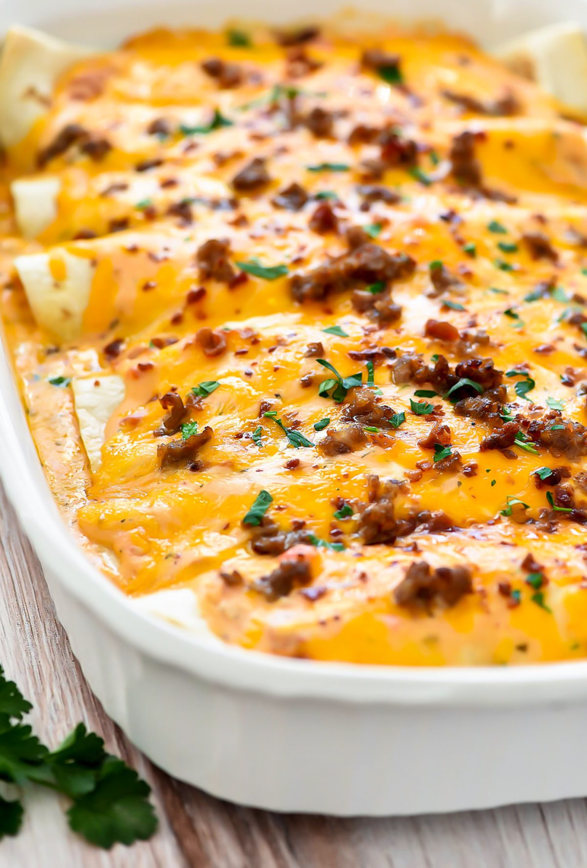 Hearty and delicious sausage, bacon and egg enchiladas.