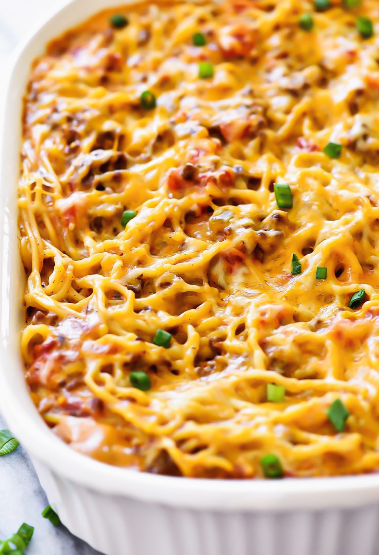 Taco Spaghetti is filled with ground beef, tomatoes, green chilies, taco seasonings and cheese with spaghetti noodles.