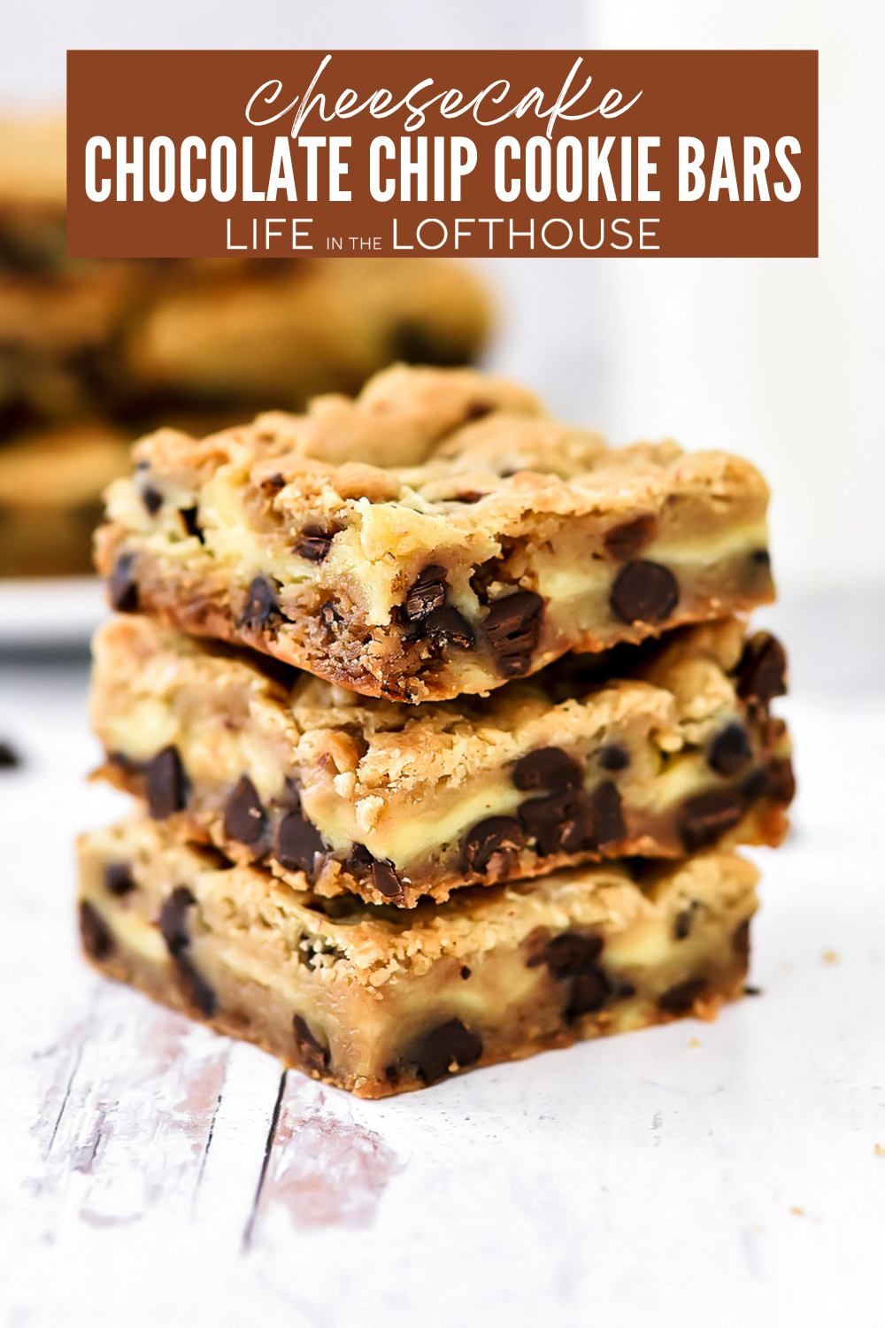 Cheesecake Chocolate Chip Cookie Bars are decadent homemade cookie bars made with a layer of creamy cheesecake in the center. The ultimate dessert!