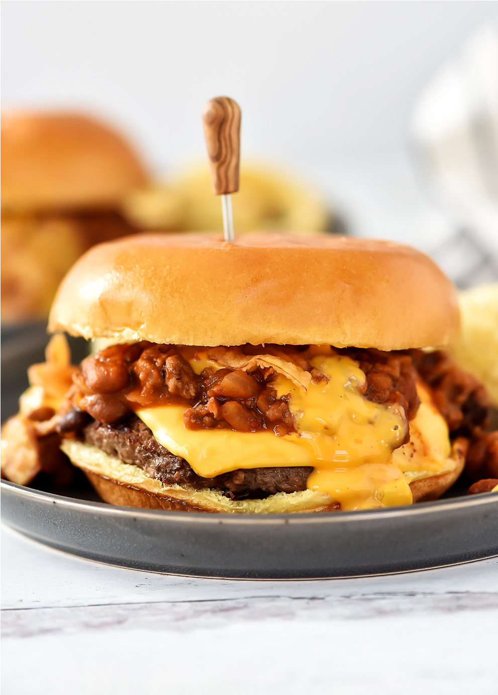 Cheeseburgers topped with warm chili, melty cheese and crispy onion strings. Life-in-the-Lofthouse.com