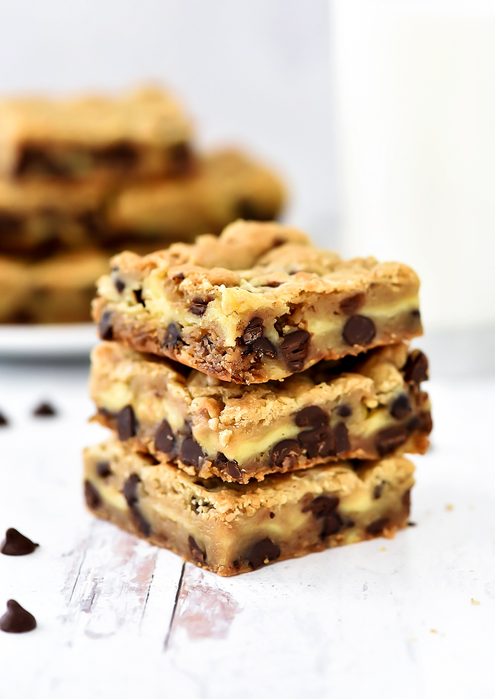 Layers of chocolate chip cookie and cheesecake are what is inside these Cheesecake Chocolate Chip Cookie Bars.