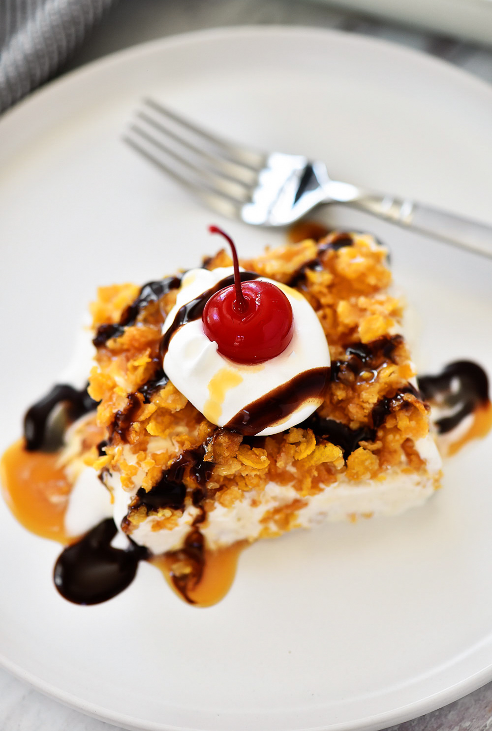 Fried Ice Cream Dessert has an amazing crust&nbsp;that coats&nbsp;a&nbsp;dreamy, cinnamon ice cream combo and is drizzled with chocolate and caramel sauce. Life-in-the-Lofthouse.com