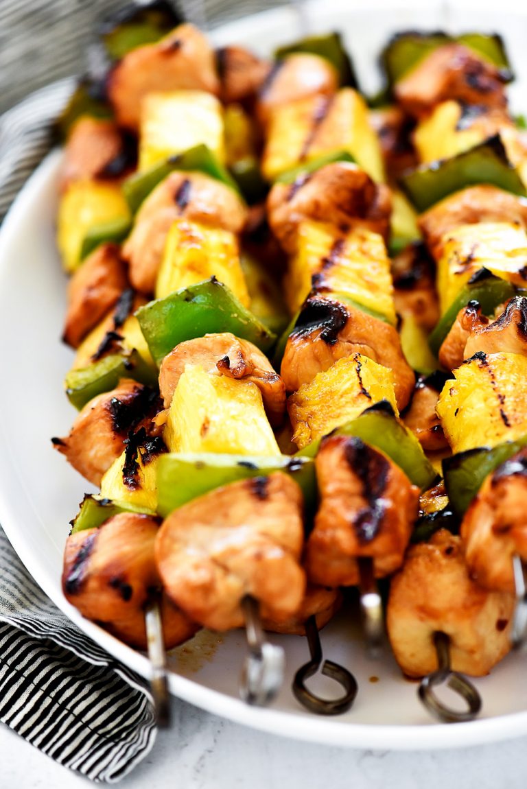Teriyaki Chicken Kebabs are marinated pieces of chicken, with pineapple and bell pepper threaded onto skewers then grilled.