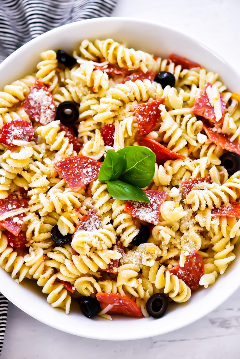 Tender pasta, zesty pepperoni and Italian dressing come together to create this Pepperoni Pizza Pasta Salad. Enjoy the perfect potluck or barbecue side dish that has all of the delicious flavors of pizza! Perfect for Menu Plan Monday.