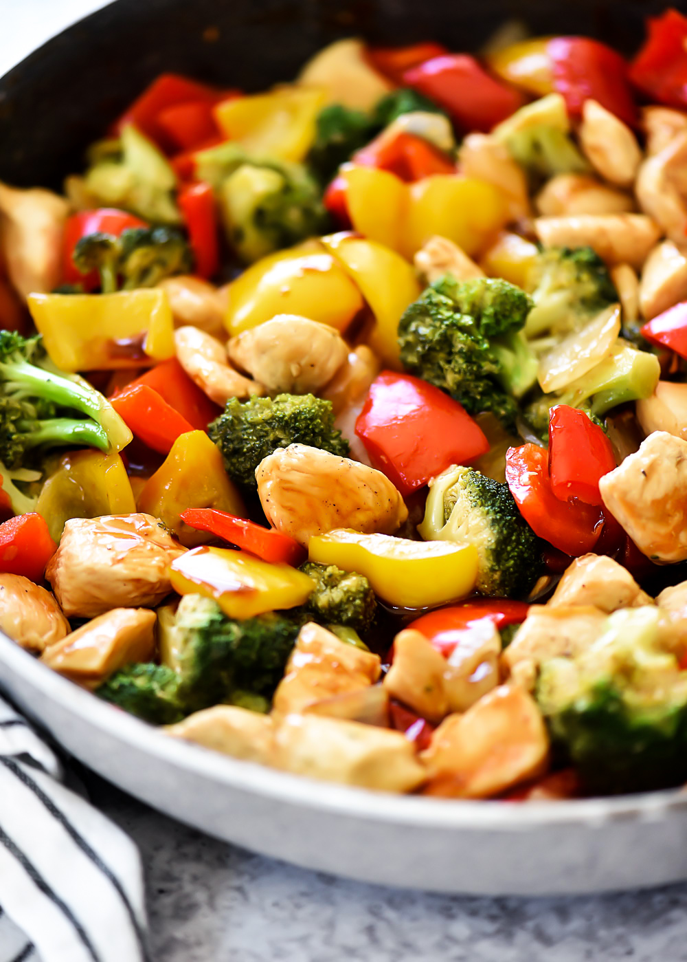 Chicken Stir Fry is seasoned chicken, red bell peppers, and onion served over a bed of brown rice. Life-in-the-Lofthouse.com