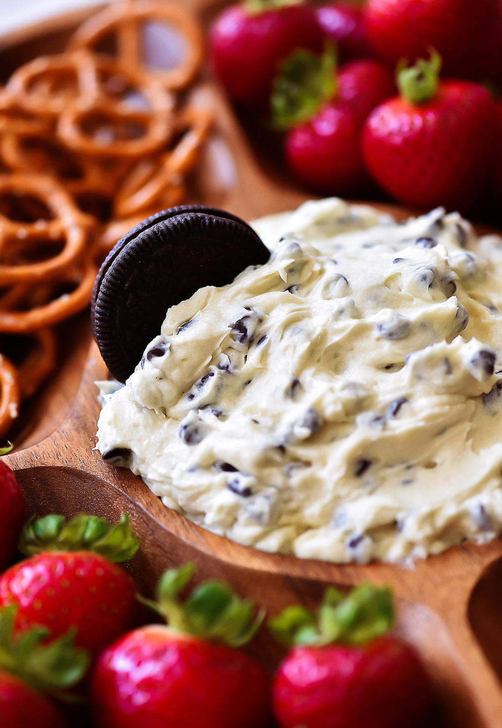 Cookie Dough Dip with an Oreo in it and strawberries and pretzels