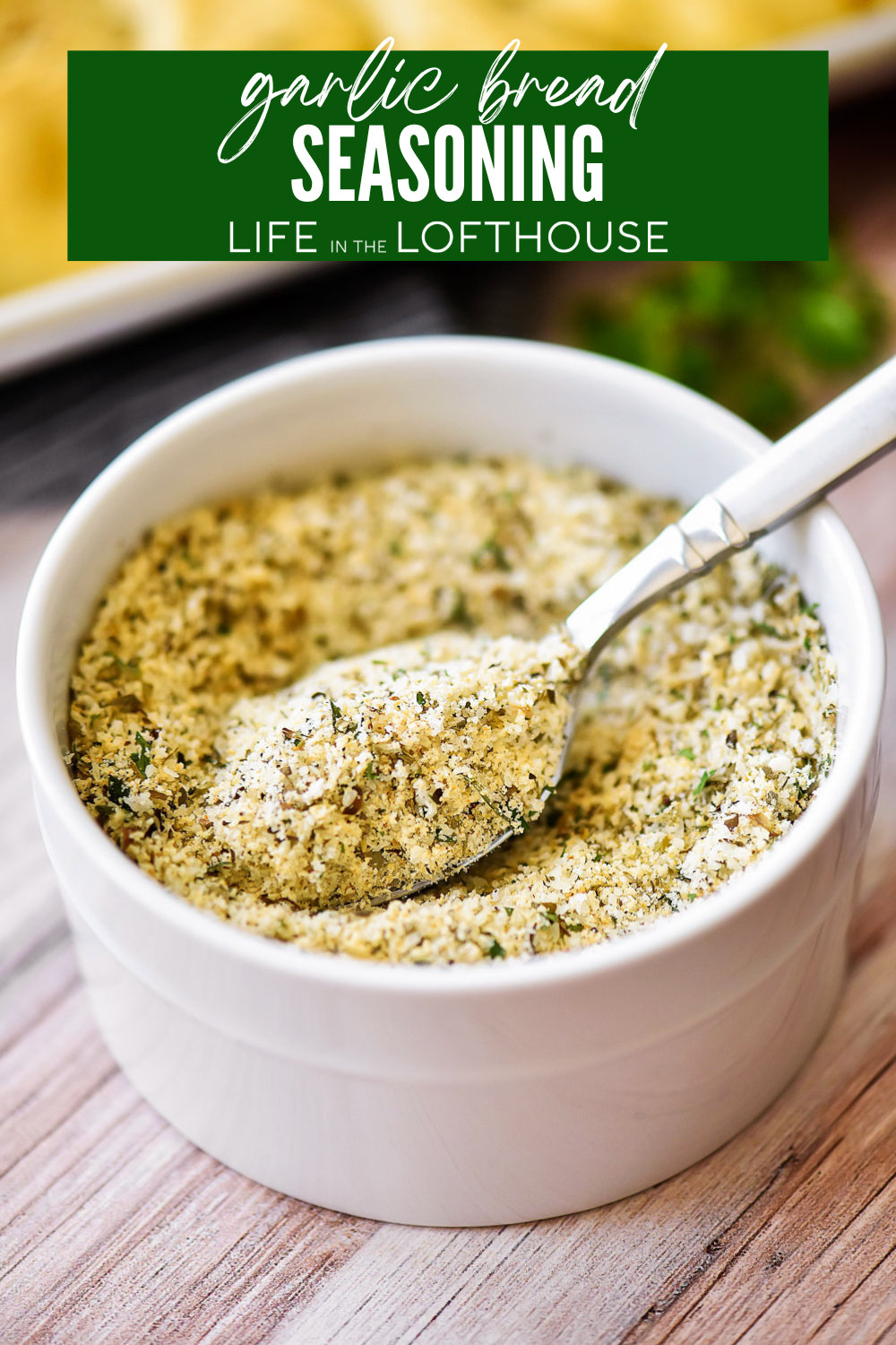 Homemade Garlic Bread Seasoning in a bowl with a spoon