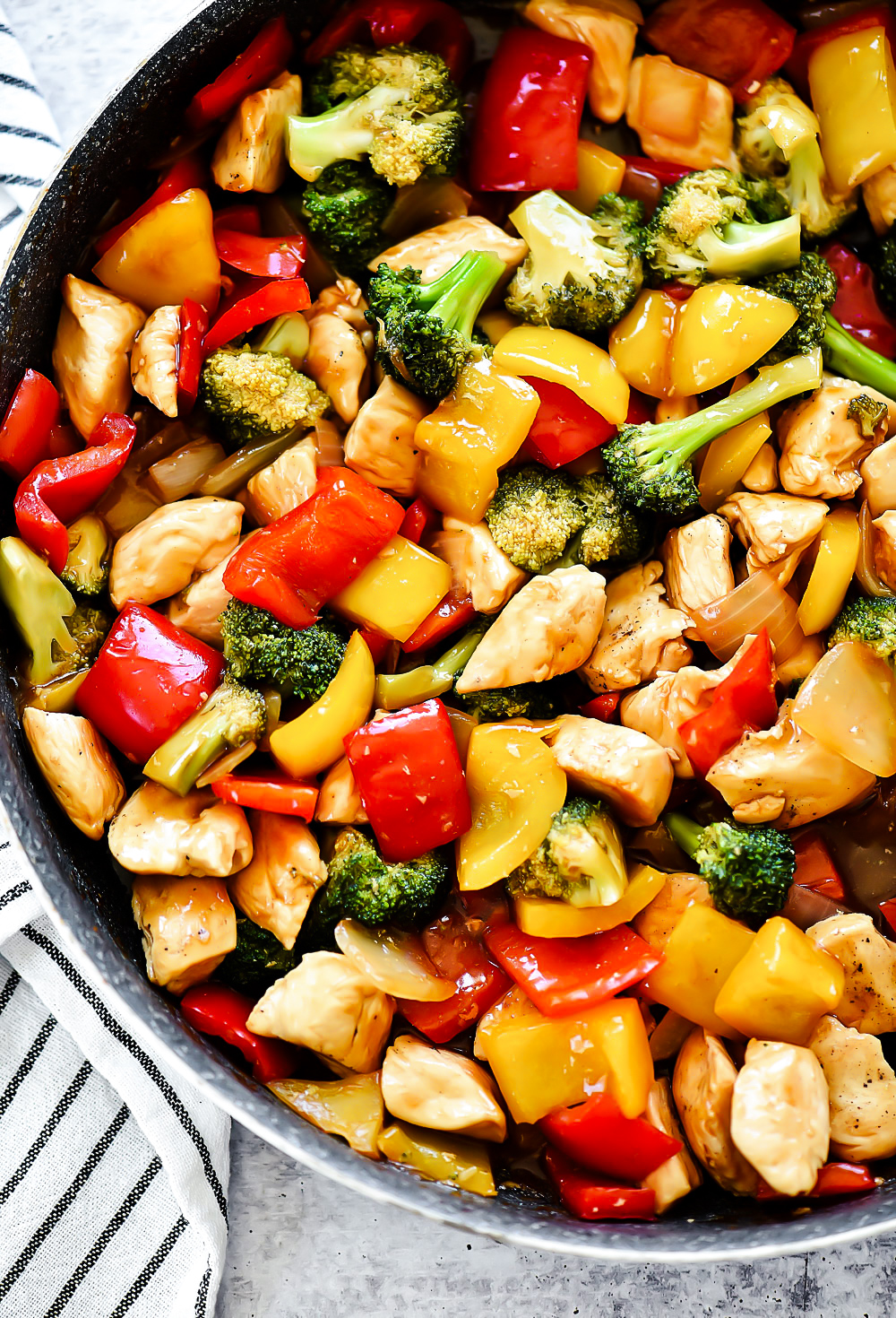 Chicken Stir Fry is seasoned chicken, red bell peppers, and onion served over a bed of brown rice. Life-in-the-Lofthouse.com