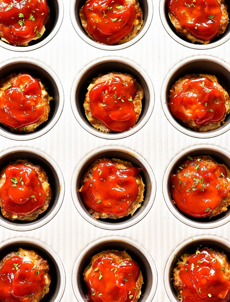 Mini Meatloaf Cups made with ground beef, cottage cheese, breadcrumbs and more. Topped with ketchup.