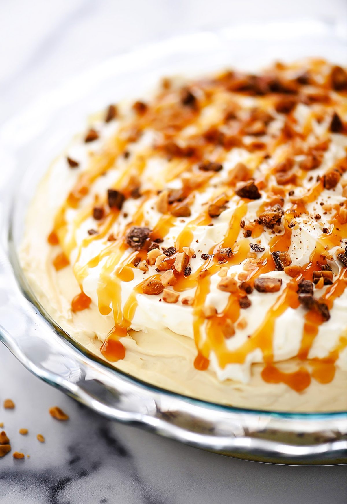 Caramel Cream Pie is filled with a sweet cream cheese and caramel filling over a sugar cookie crust.
